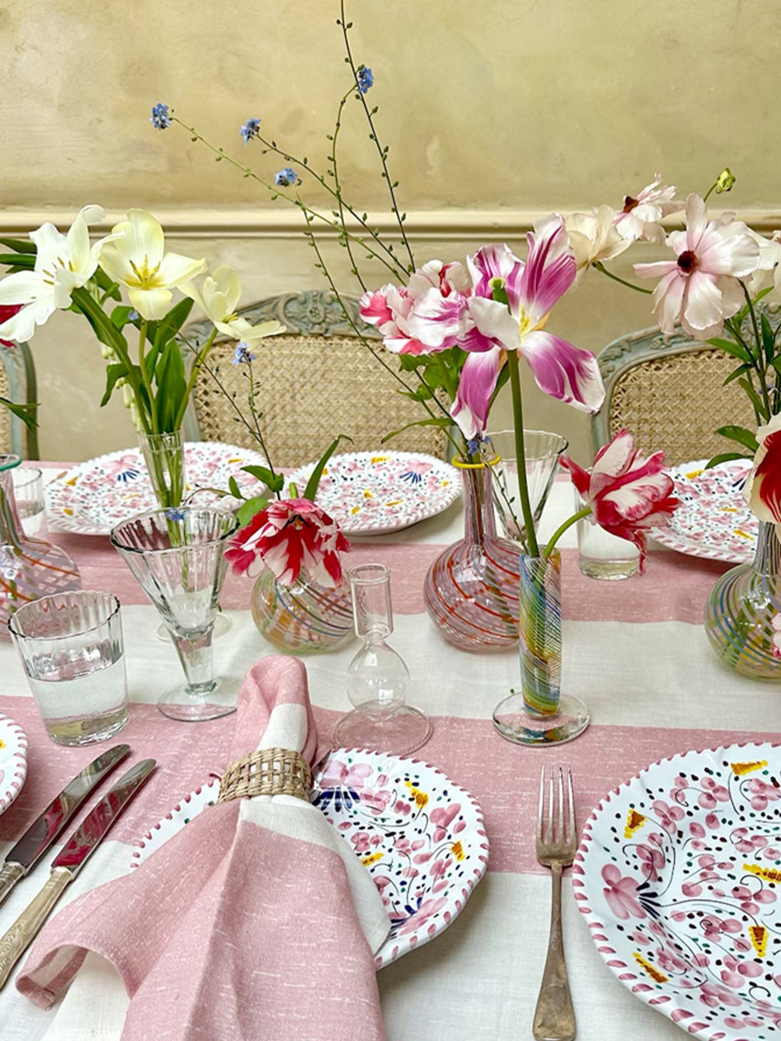 Pink table setting with rattan napkin rings